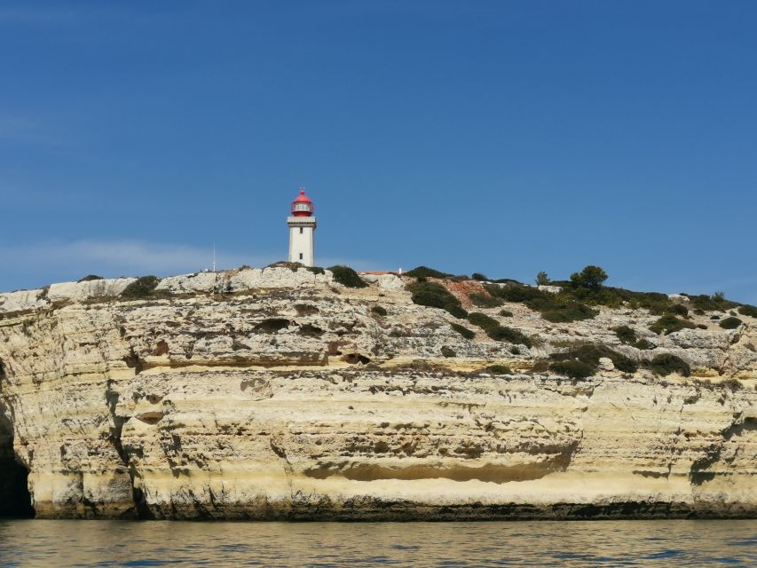 Albufeira: Coastline and Benagil Caves Tour by Catamaran - Guides, music, and the onboard atmosphere