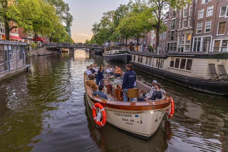 Amsterdam: 2-Hour Luxury Canal Cruise with Snacks & Drinks - The Amstel, Skinny Bridge, and evening light
