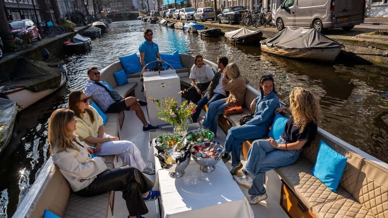 Amsterdam: Canal Cruise in Open Boat with Drink Option - What the skipper adds to the ride