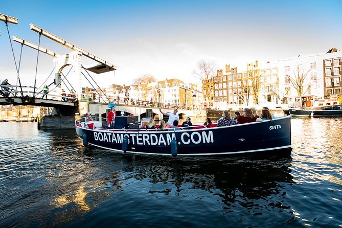 Amsterdam Canal Cruise With Live Guide and Unlimited Drinks - The eastern loop: Waterlooplein, NEMO, and the maritime quarter