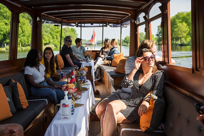 Amsterdam Classic Saloon Boat Cruise with Drinks and Cheese - When the Covered Design Helps, and When It Does Not