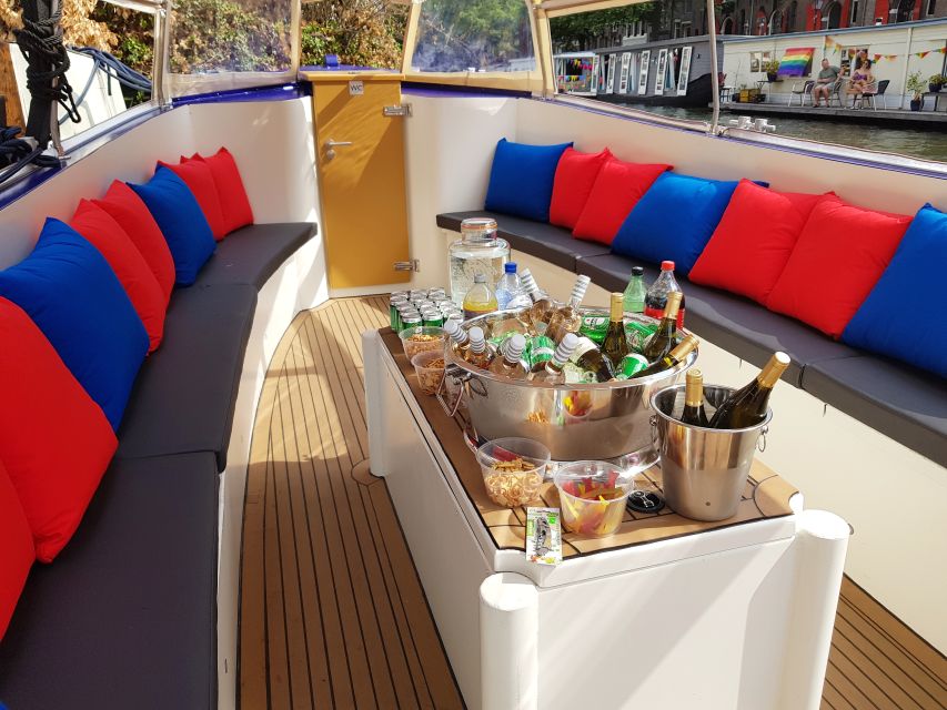 Amsterdam: Covered Canal Booze Cruise with Unlimited Drinks - The covered boat, rain, and comfort