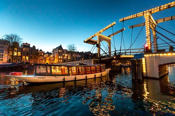 Amsterdam Evening Canal Cruise with Live Guide and Onboard Bar - Boarding near Amsterdam’s central canals