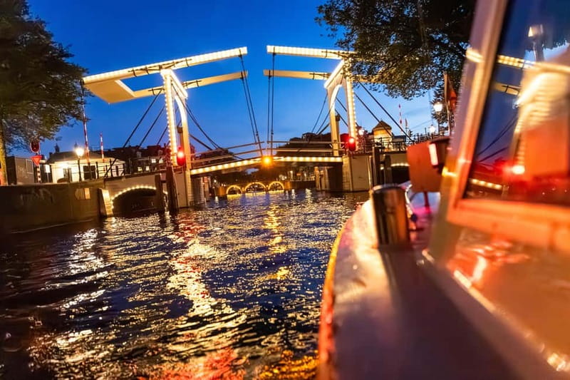 Amsterdam: Evening Cruise with Optional Wine and Snacks - Audio guide, captain, and comfort