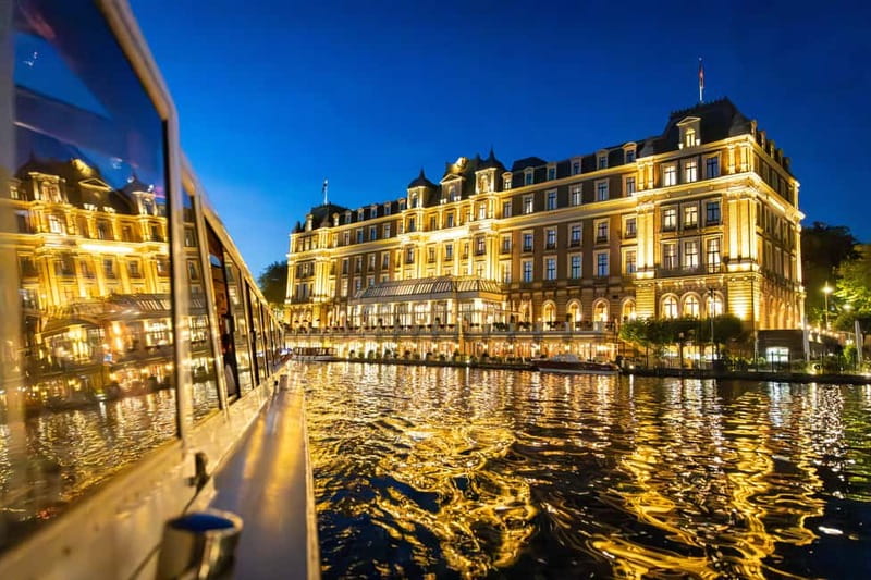 Amsterdam: Evening Cruise with Optional Wine and Snacks - The Amstel, Magere Brug, and illuminated bridges
