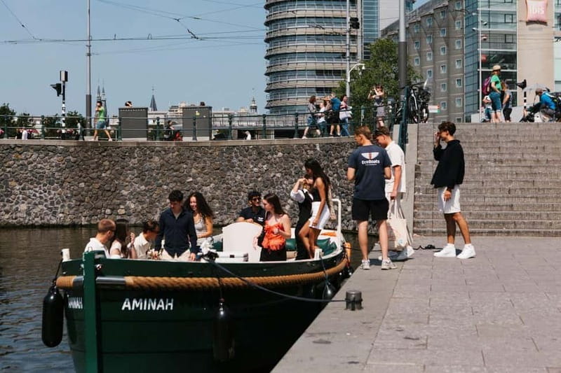 Amsterdam Evening (Sunset) Canal Cruise w/ optional drinks - Meeting the Eco Boats crew near Central Station