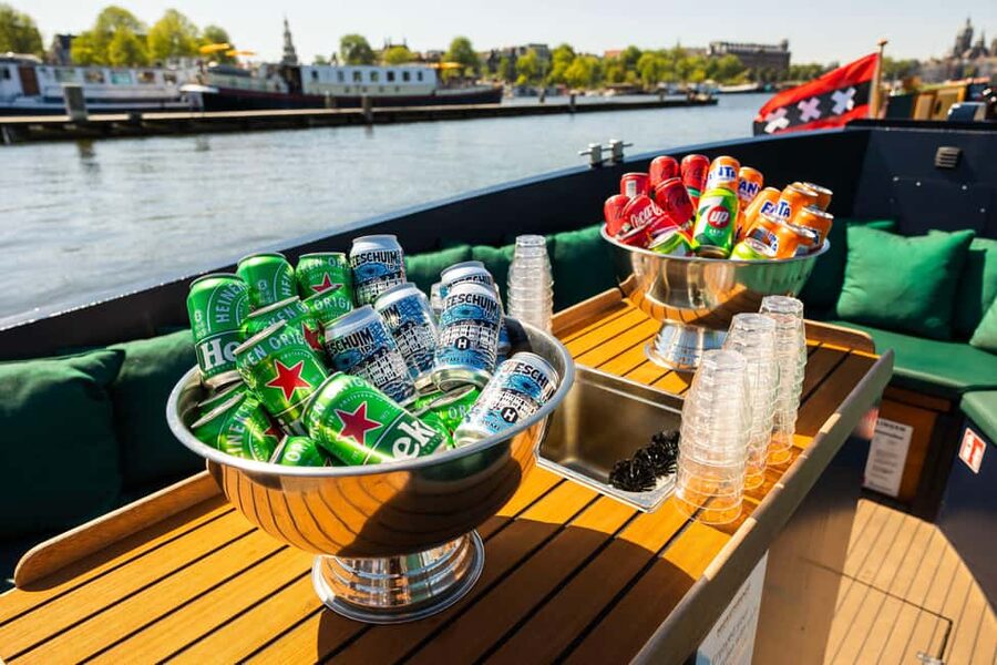 Amsterdam: Guided Open Boat Cruise Unlimited Drinks Option - Montelbaanstoren and the eastern canals