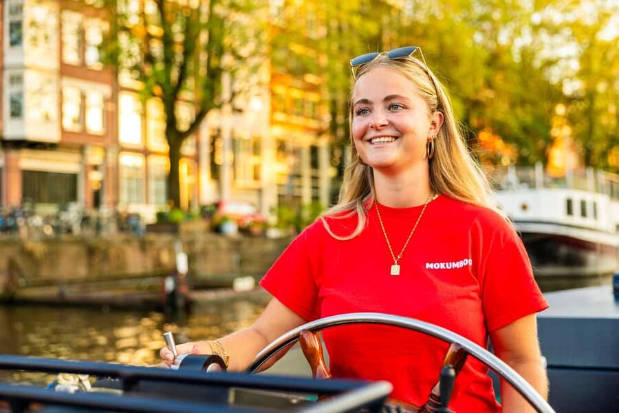 Amsterdam: Guided Open Boat Cruise Unlimited Drinks Option - Seven bridges, grand canals, and elegant houses