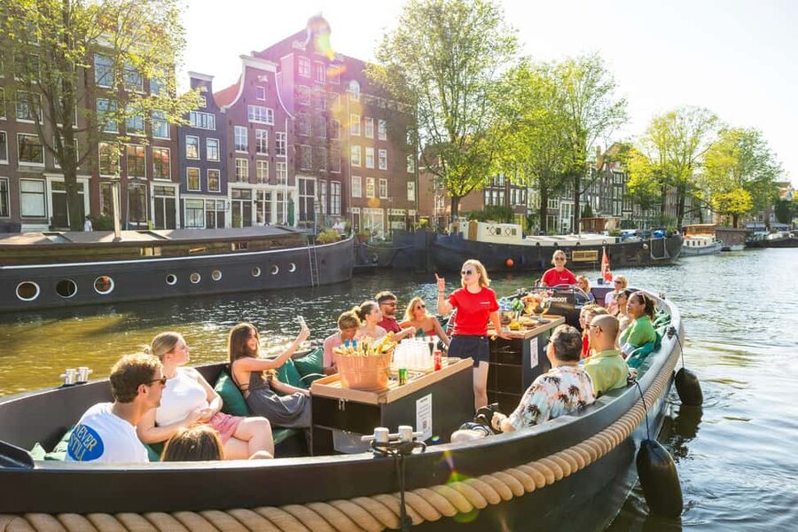 Amsterdam: Guided Open Boat Cruise Unlimited Drinks Option - From Centraal Station to the old harbor