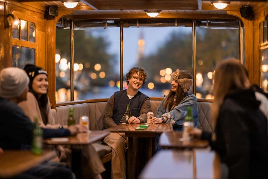 Amsterdam: Heated Canal Cruise with Unlimited Drinks & Bite - Boarding, seating, and the changing boat setup