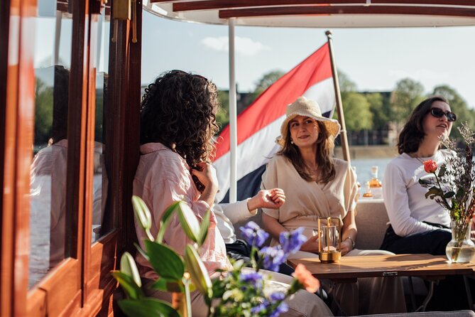 Amsterdam: Luxury Saloon Boat Cruise with Cocktails & Waffle - The Amstel, Magere Brug, and the final stretch