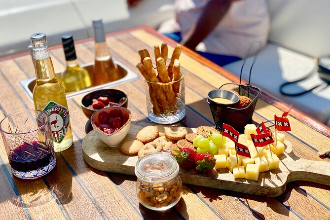 Amsterdam Small-Group Canal Cruise Including Snacks and Drinks - Warehouses, the Maritime Museum, and Hortus Botanicus