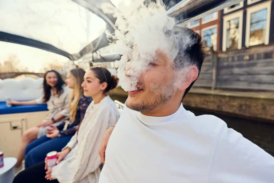 Amsterdam: Smoke & Cruise on covered Cannabis Boat With Bar - Five Minutes by Amsterdam Centraal Station