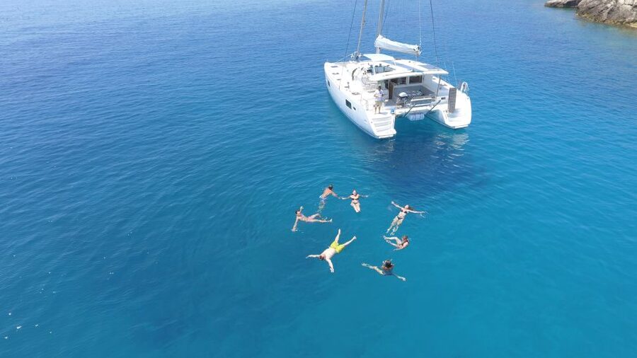 Athens: Riviera Catamaran Cruise with Meal and Drinks - Crew service from pickup to return