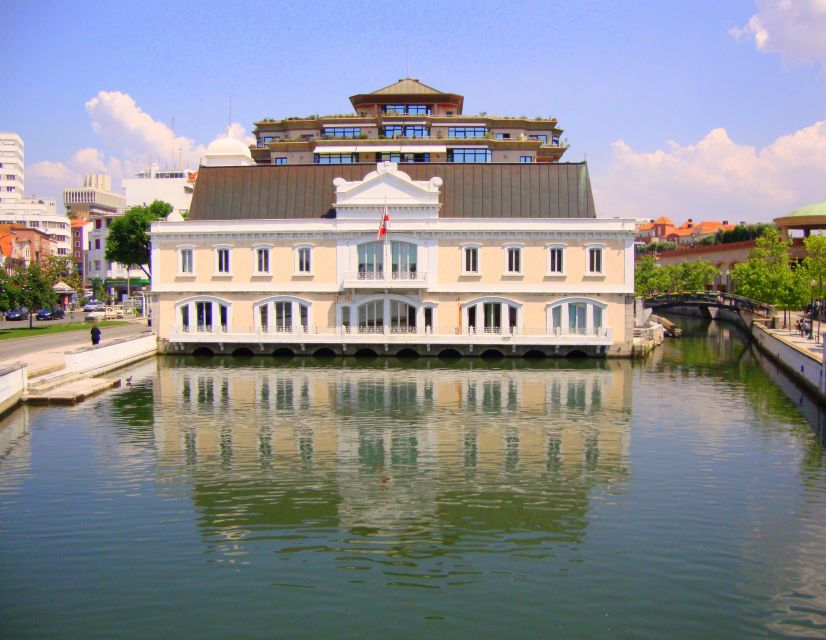 Aveiro: Walking Tour, Boat Cruise, Sweets & Church Entrance - Boarding an authentic Moliceiro boat