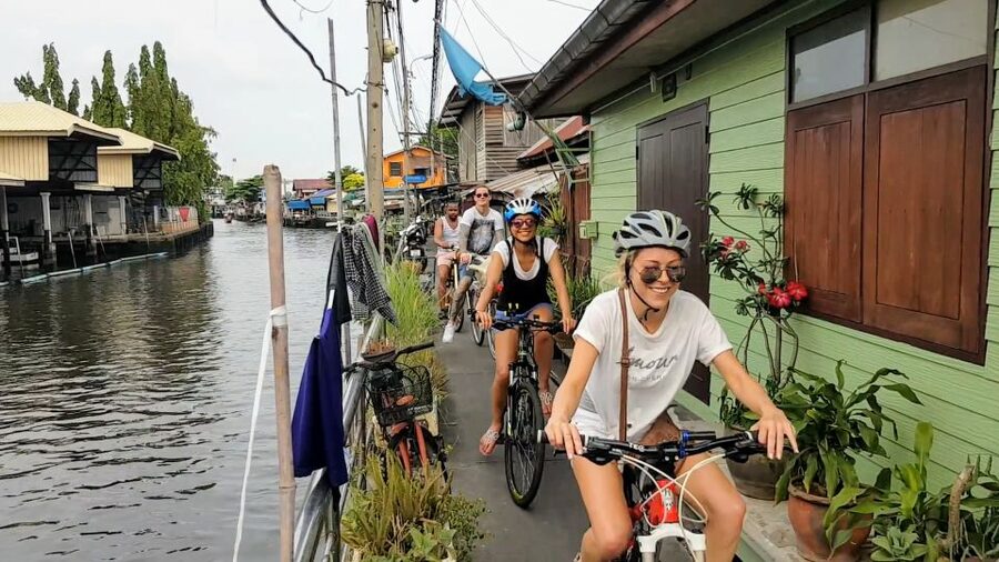 Bangkok: Bike and Canal Boat Tour with Lunch - Loading the bicycles onto a long-tail boat