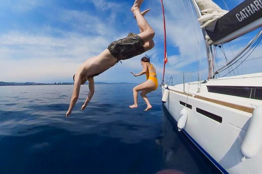 Barcelona: Coastline Boat Trip with Snacks and Cava - A small boat with a friendly social feel
