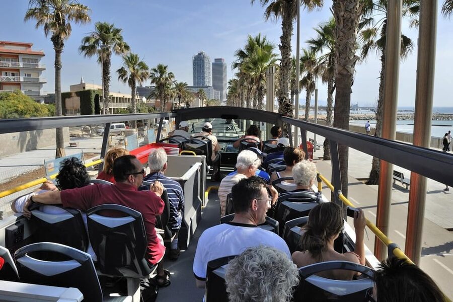 Barcelona: Hop-On Hop-Off Bus with Sailing Cruise - Riding the orange West route to Camp Nou and Montjuïc