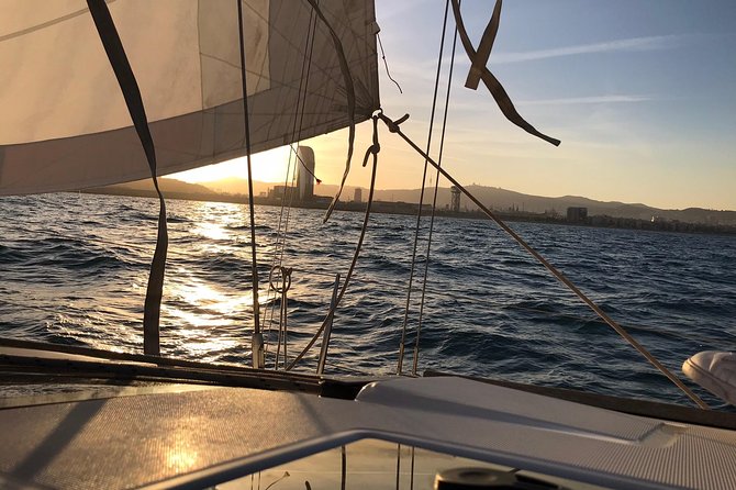 Barcelona Sunset Cruise with Light Snacks and Open Bar - Sailing past Barcelona’s waterfront landmarks