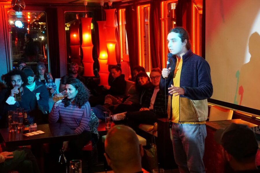 Berlin: Laughing Spree Comedy Show on a Boat - East Side Gallery views before and after the jokes
