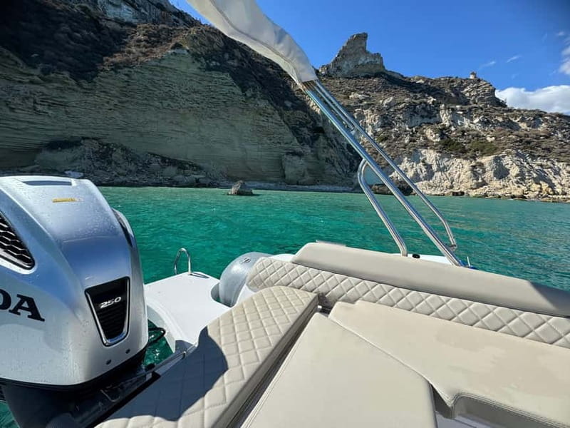 Cagliari: Boat Tour with 4 Swim Stops, Snorkeling & Prosecco - Cala Fighera: cliffs and a swim from the boat