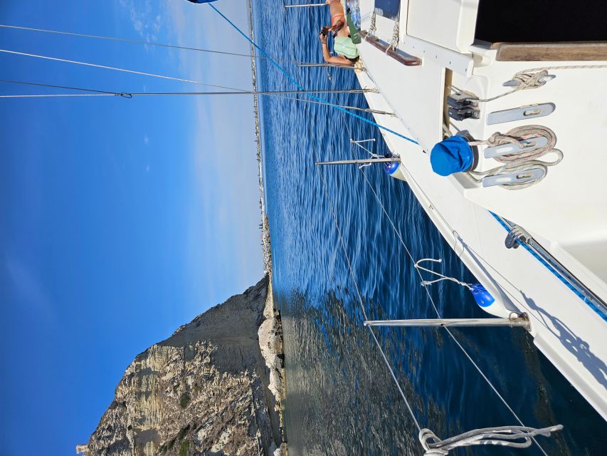 Cagliari Sailing Boat Tour with Snorkeling and Drink - Following the Poetto coast toward Devil’s Saddle