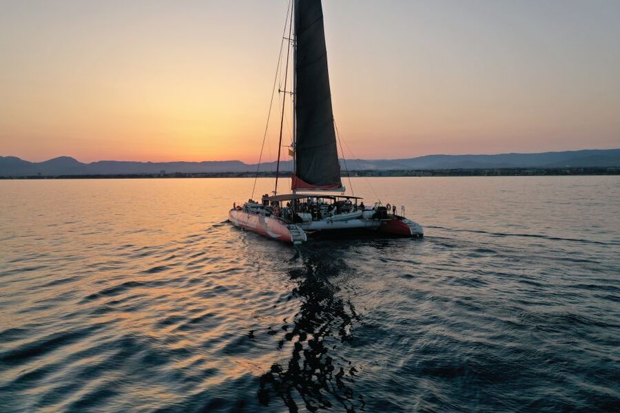 Cambrils: Sunset Catamaran Cruise & Drinks w/ Sunbed - The Coast Toward Montroig