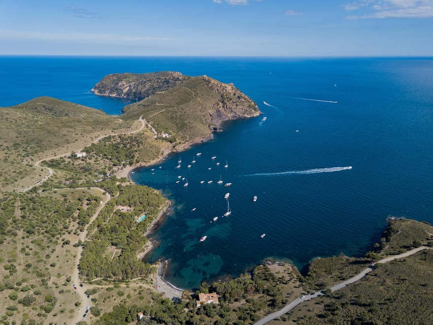 Cap Norfeu: Costa Brava Catamaran Trip with Underwater Views - Cap Norfeu and the protected coast near Jóncols Bay
