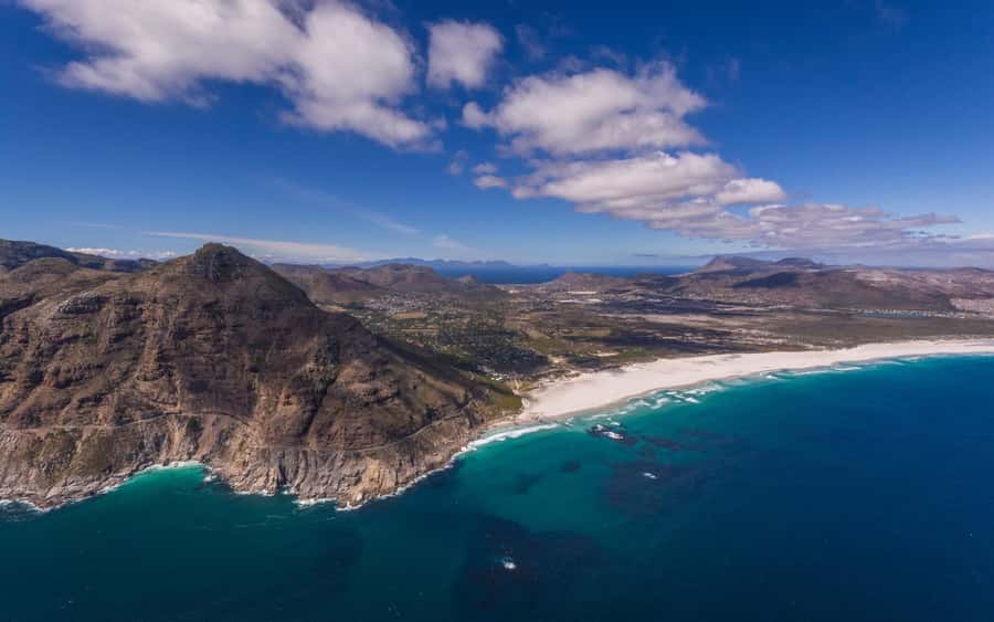 Cape Town: 2 Oceans Helicopter Flight with Boat Tour Ticket - Muizenberg, whales, and the return route