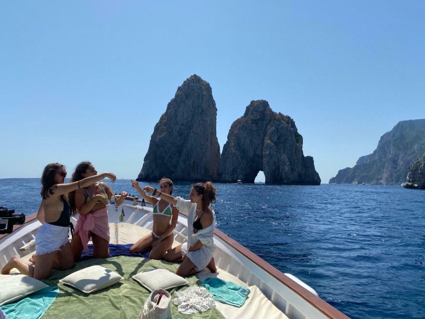 Capri: Island and Grottos Boat Cruise with Snacks and Drinks - Limoncello, snacks, and the onboard mood
