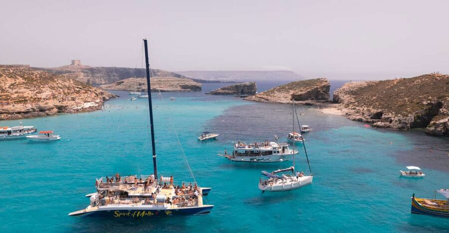 Comino: Blue Lagoon Catamaran Cruise with Lunch and Open Bar - Leaving Sliema on the Spirit of Malta