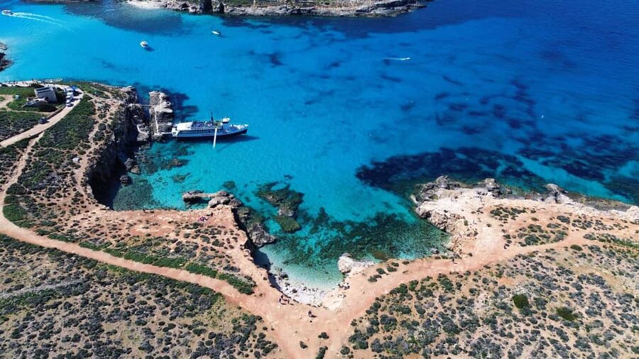 Comino: Blue Lagoon & Caves Boat Cruise - Returning through Crystal Lagoon and past St. Mary’s Tower