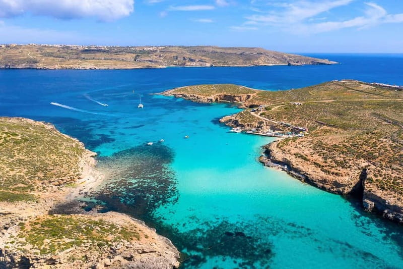 Comino: Blue Lagoon, Crystal Lagoon and Sea Caves Boat Tour - The first cruise: Comino Tower and the open water