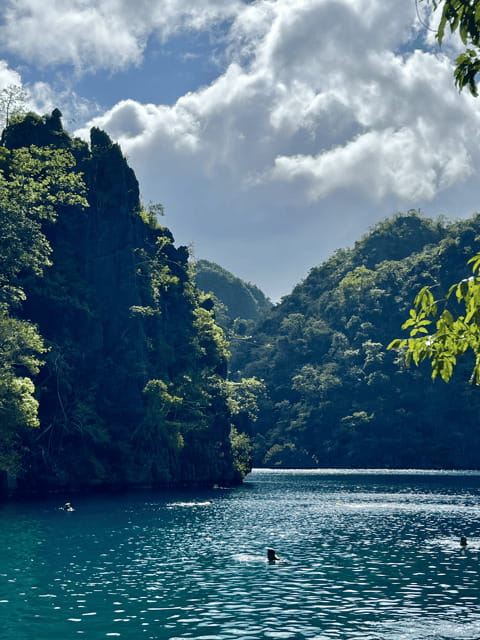 Coron: Private Boat Hire with Guided Tour and Lunch on Beach - Coral gardens, reefs, and time in the water