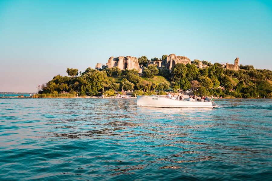 Desenzano del Garda: Sunset Boat Trip at Sunset with Drink - Setting sail from Desenzano harbor