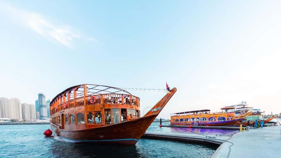 Dubai: Scenic Dhow Cruise with Buffet Dinner and Live Shows - Boarding a traditional dhow