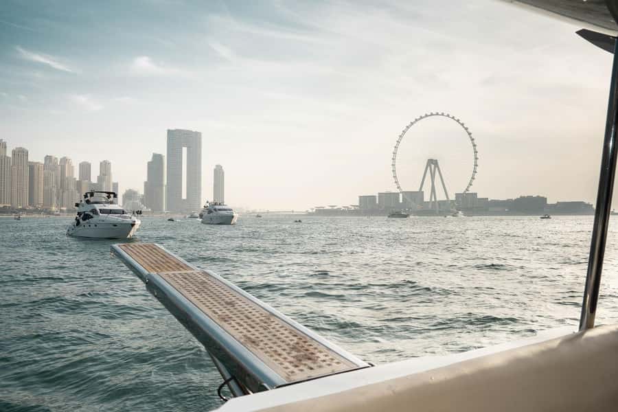 Dubai: Sunset & Night Cruise with Bites and Drinks - The water can be choppy, and the yacht can vary