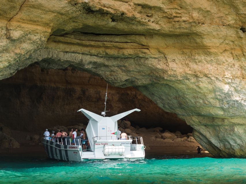 From Albufeira: Dolphins and Caves 2.5-Hour Boat Trip - Guides, languages, and atmosphere