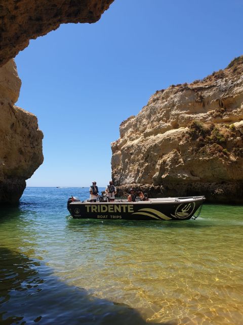 From Armação de Pêra: Benagil Caves and Beaches Boat Tour - The first stops: Beijinhos to Nossa Senhora da Rocha