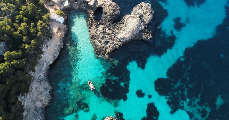 From Cala Figuera: Boat Tour to Cala Marmols & Caló de Moro - Leaving Cala Figuera on a small RIB