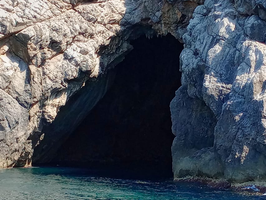 From Can Picafort: Dolphin Watching and Cave Boat Trip - Looking into the sea cave