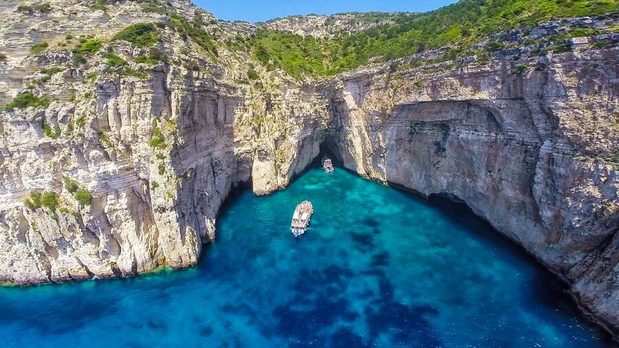 From Corfu: Day Cruise to Paxos, Antipaxos, and Blue Caves - Leaving Corfu with old-town views