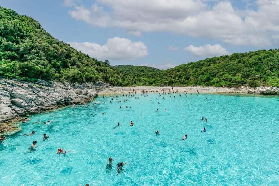From Corfu Island: Antipaxos & Paxos Blue Caves Boat Cruise - The return route passes smaller islands