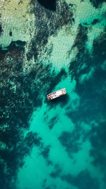 From Lagos: Ponta da Piedade Caves Kayak Tour from Catamaran - The Catamaran Ride Toward Ponta Da Piedade