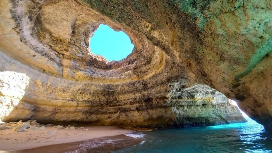 From Portimão: Algar de Benagil and Sea Caves Boat Tour - Praia da Marinha, a highlight near the far end