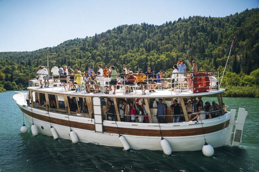 From Split: Krka Waterfalls Tour with Boat Cruise & Swimming - The panoramic boat ride toward Skradin