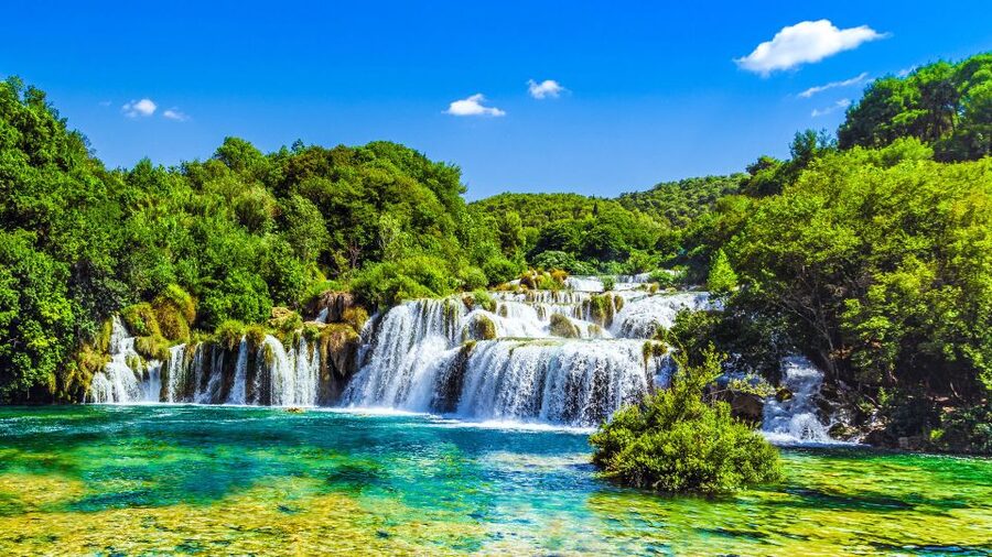 From Split & Trogir: Krka Waterfalls Day Tour with Boat Ride - Free time in Skradin for swimming and lunch