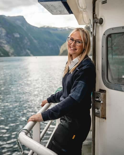 Geiranger: Fjord and Waterfalls Sightseeing Boat Trip - The first stretch: cliffs, water, and old farm country