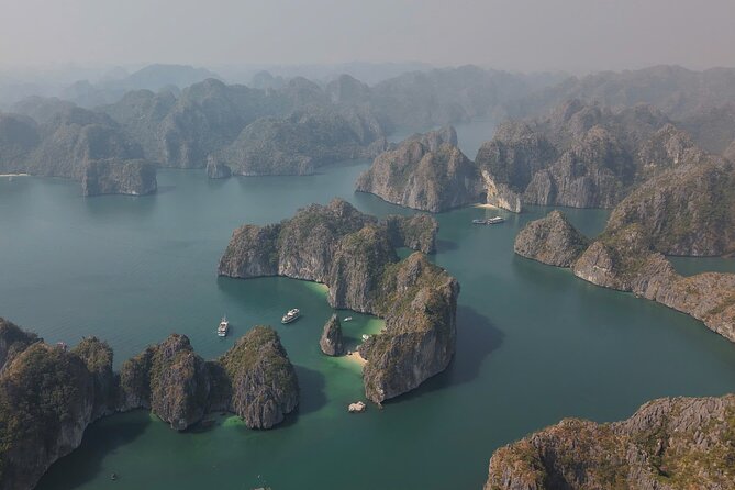 Ha Long Bay Cruise Day Tour - Cave, Kayaking, Swimming & Lunch - Ti Top Island for swimming and a high view