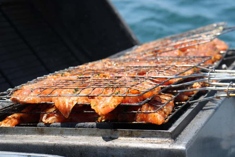Half-Day Boat Trip in Agadir: Fishing, Fish BBQ & Swimming - Lunch on deck with grilled fish and Moroccan sides